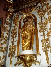 Joseph tenant l'enfant J�sus et un rameau fleuri dans une main